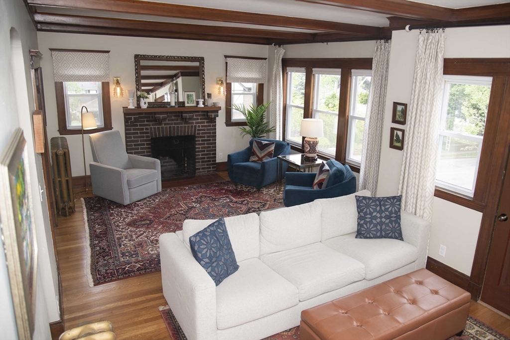 3 Chester Road, Unit 3 Belmont, MA 02478 - Photo 12 of 40 a living room with furniture and a fireplace