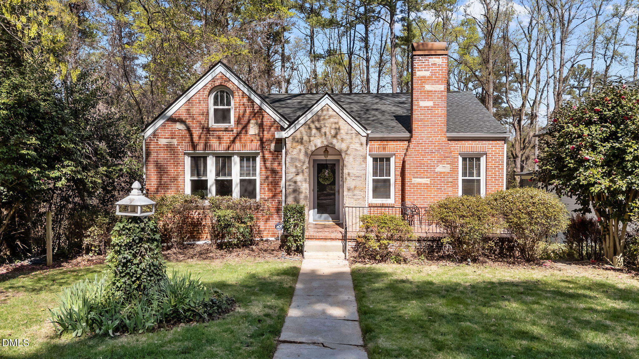 3322 Ruffin Street Raleigh, NC 27607 - Photo 1 of 57 a front view of a house with a yard and trees