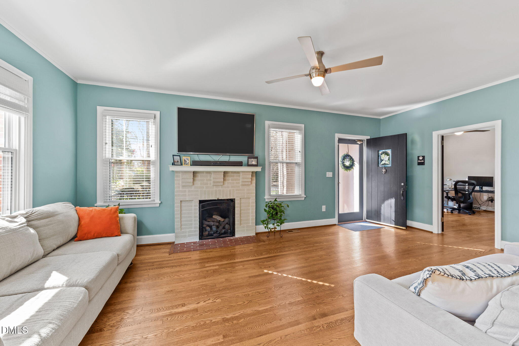 3322 Ruffin Street Raleigh, NC 27607 - Photo 13 of 57 a living room with furniture and a fireplace