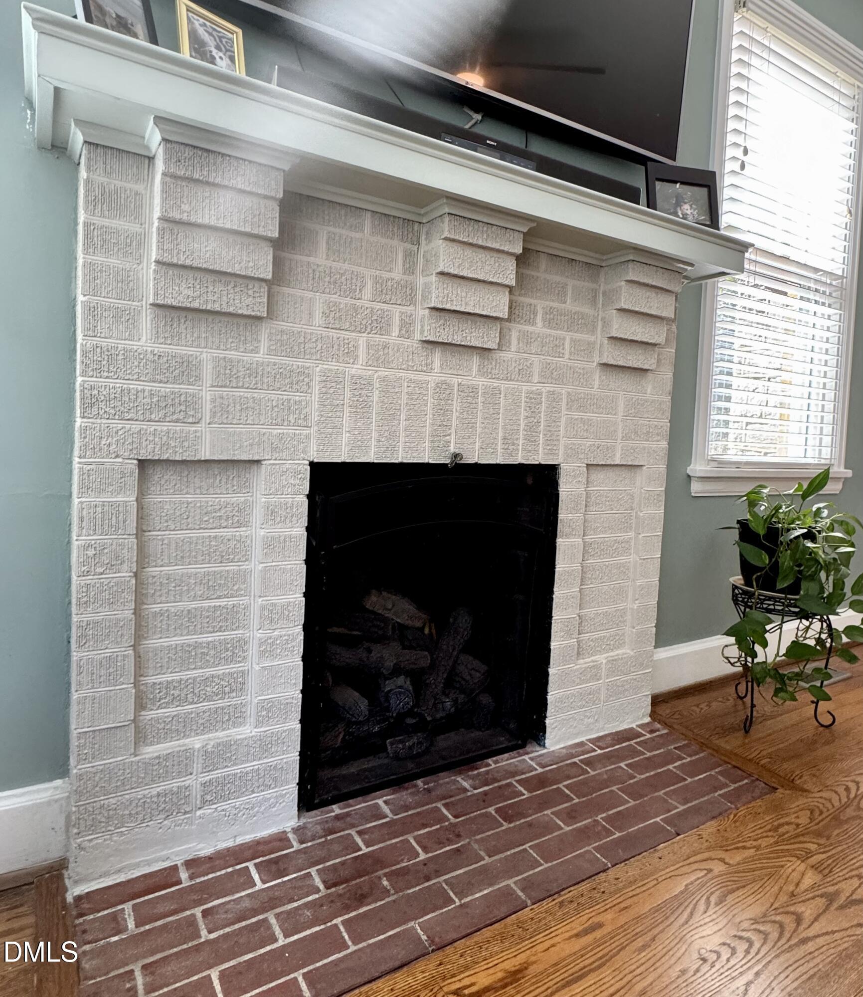 3322 Ruffin Street Raleigh, NC 27607 - Photo 14 of 57 a living room with a fireplace