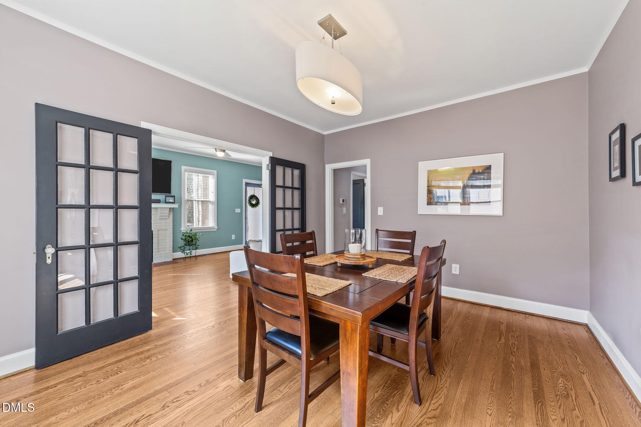 3322 Ruffin Street Raleigh, NC 27607 - Photo 18 of 57 a view of a dining room with furniture and wooden floor