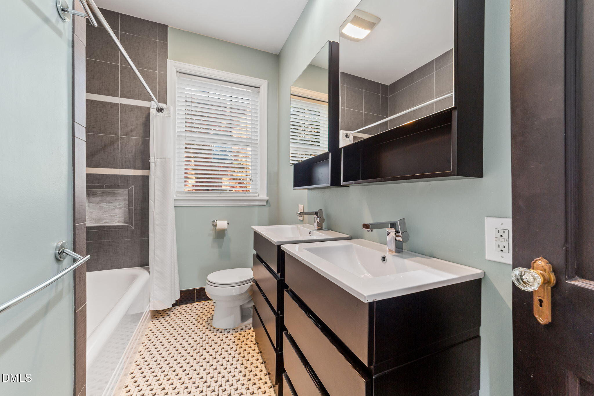 3322 Ruffin Street Raleigh, NC 27607 - Photo 31 of 57 a bathroom with a sink toilet and mirror