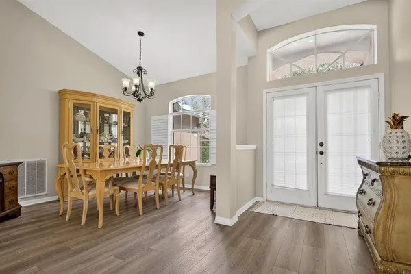 a view of a dining room with furniture window and wooden floor