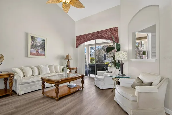 a living room with furniture and a large window