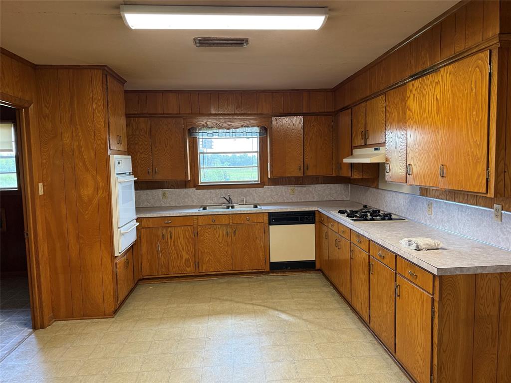 503 County Rd SE 4380 Scroggins, TX 75480 - Photo 13 of 40 a large kitchen with stainless steel appliances granite countertop a sink counter space cabinets and a large window