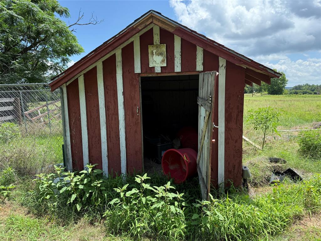 503 County Rd SE 4380 Scroggins, TX 75480 - Photo 24 of 40 a front view of a house with garden