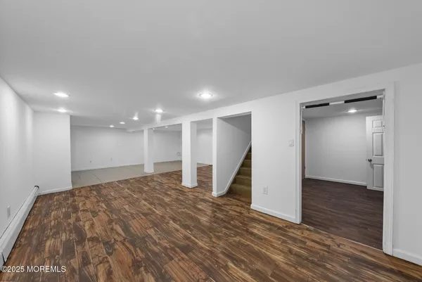 a view of a big room with wooden floor and closet