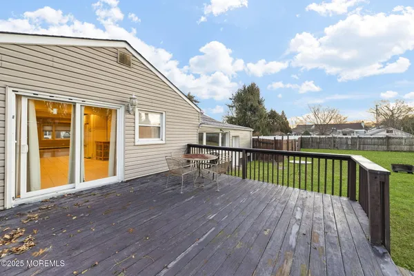 a front view of a house with a garden and plants