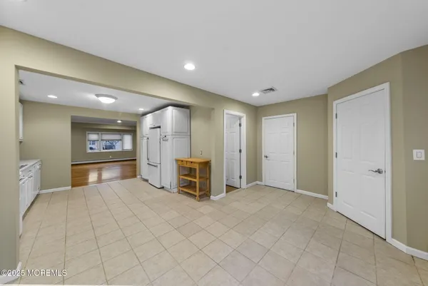 a view of a big room with furniture and a window