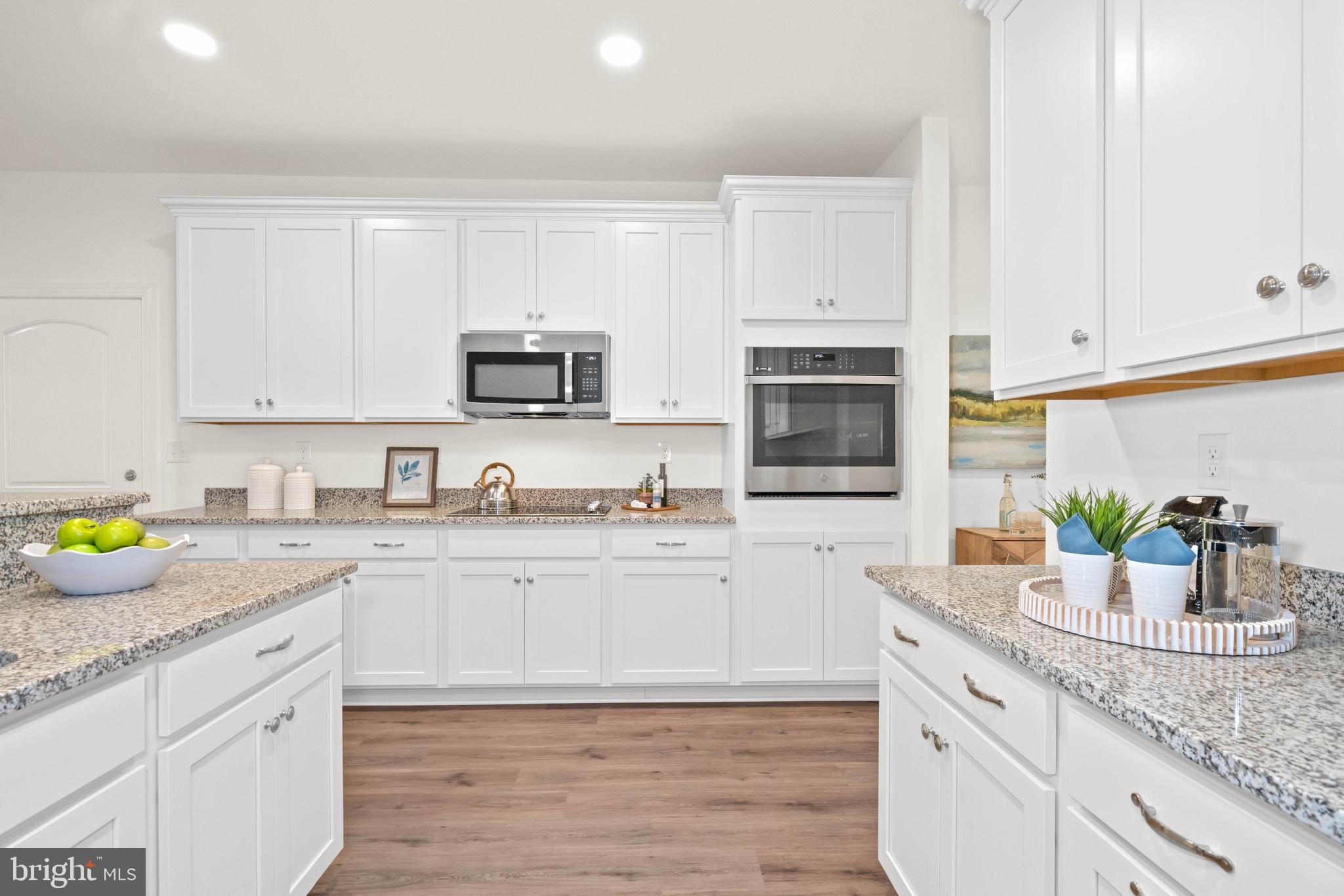 548 Longhorn Loop Middletown, DE 19709 - Photo 12 of 38 a kitchen with sink cabinets and window