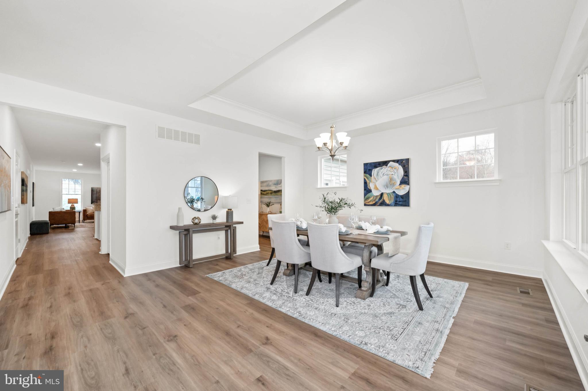 548 Longhorn Loop Middletown, DE 19709 - Photo 19 of 38 a view of a dining room with furniture and wooden floor