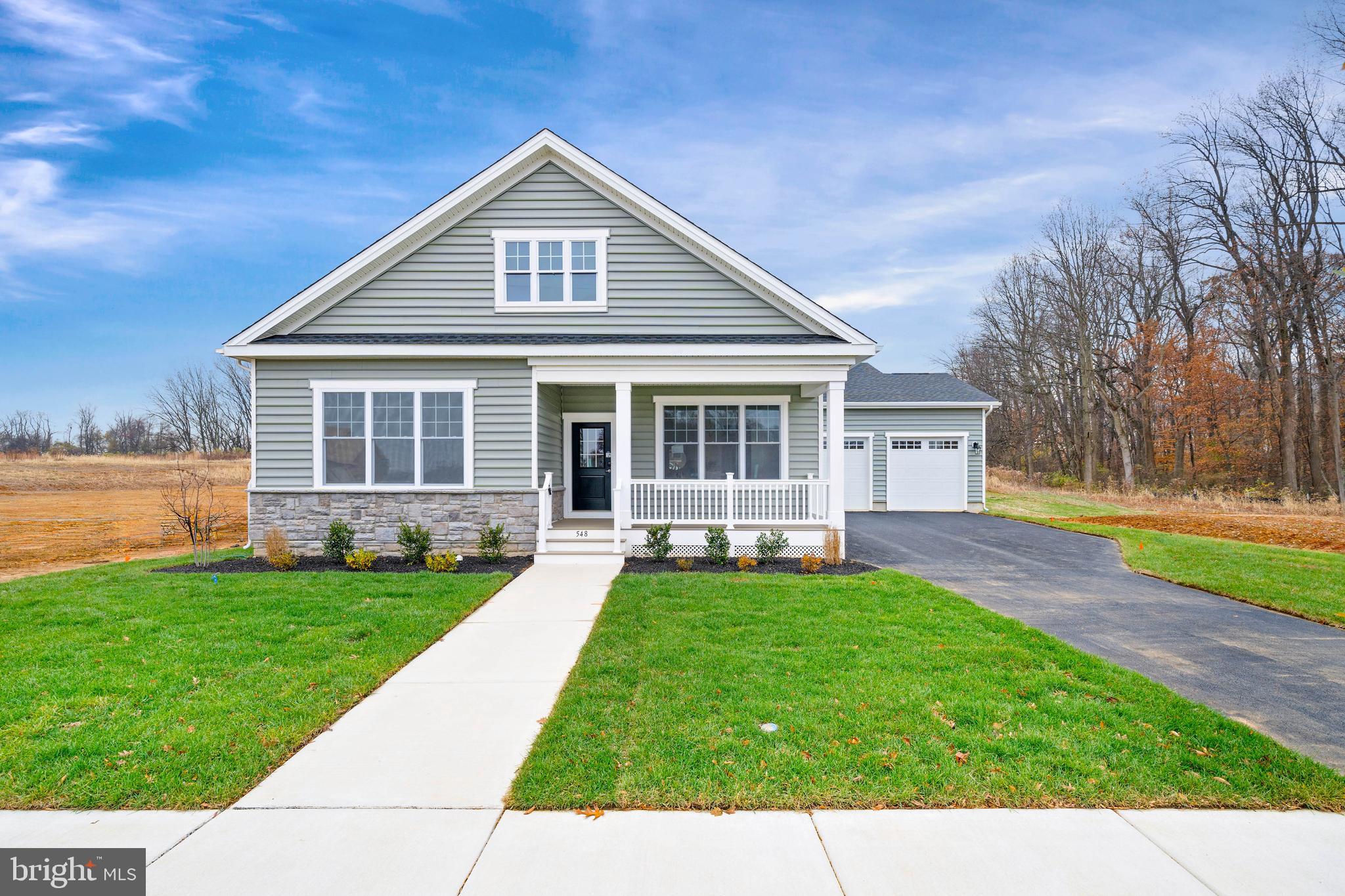 548 Longhorn Loop Middletown, DE 19709 - Photo 2 of 38 a front view of a house with a yard