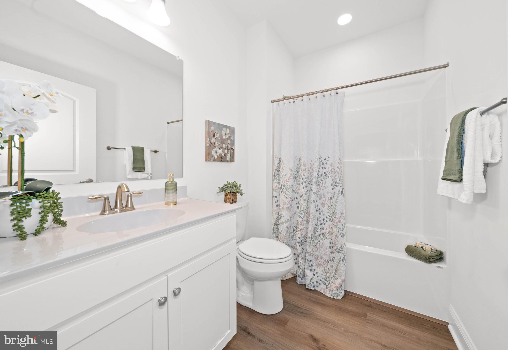 548 Longhorn Loop Middletown, DE 19709 - Photo 26 of 38 a bathroom with a sink a toilet and shower