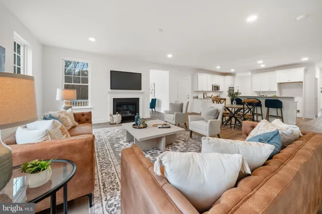 a living room with furniture fireplace and a flat screen tv