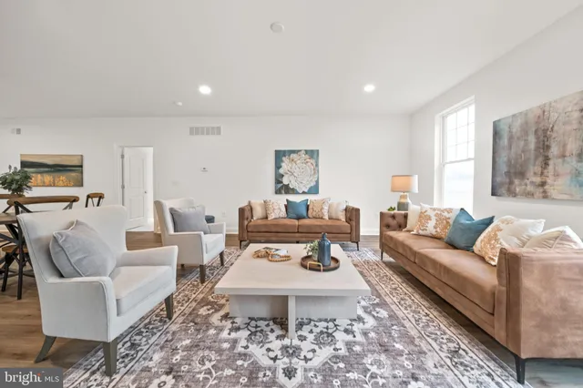 a living room with furniture and a table