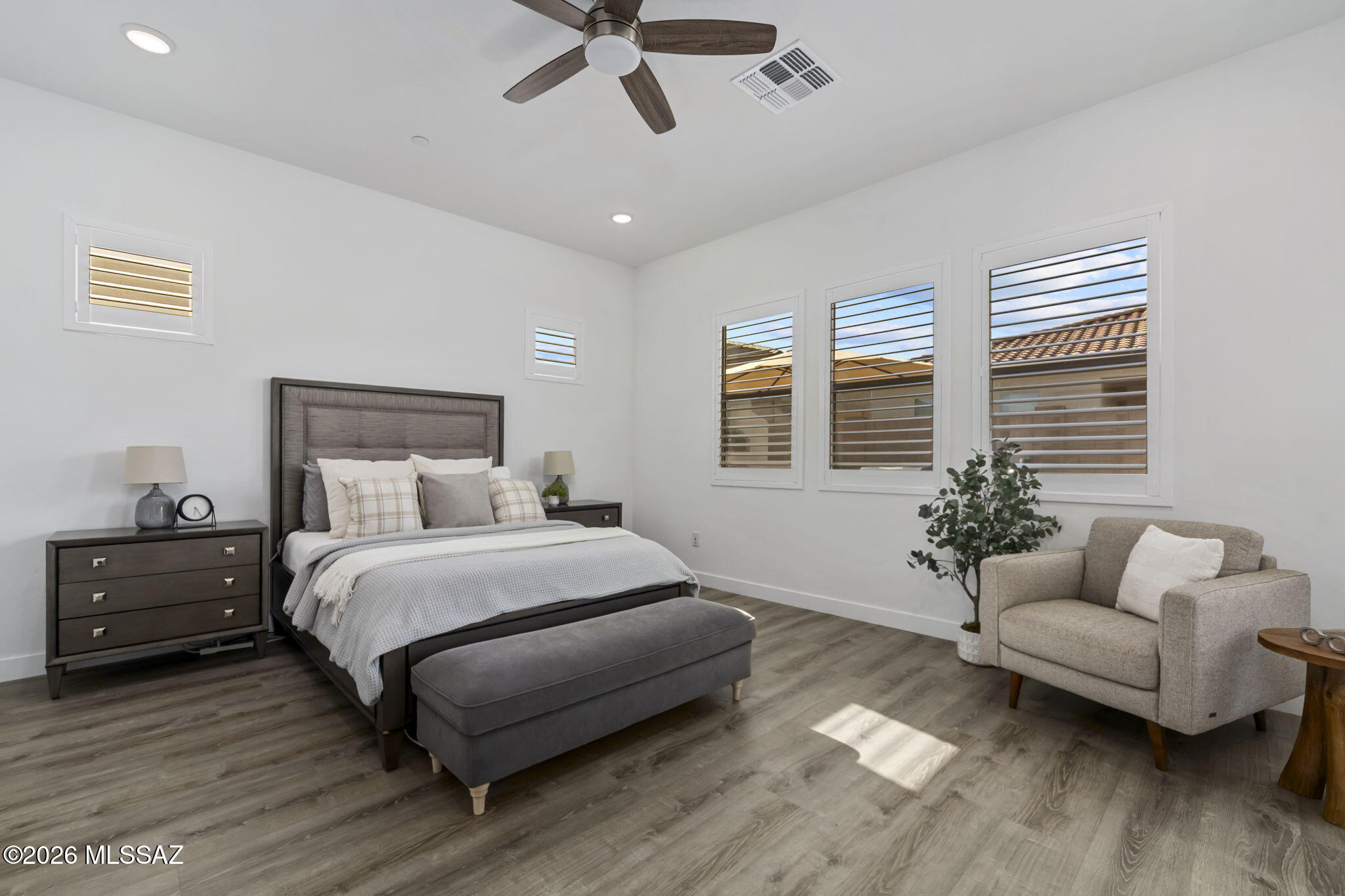 12791 East Tortoise Pointe Drive Vail, AZ 85641 - Photo 22 of 50 a bedroom with a bed and wooden floor