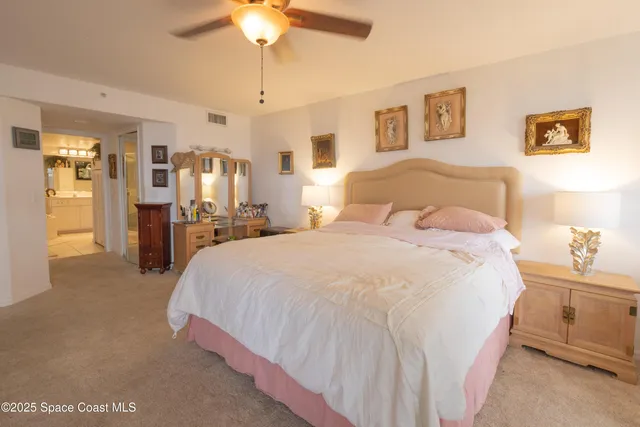 a living room with furniture a window and a flat screen tv