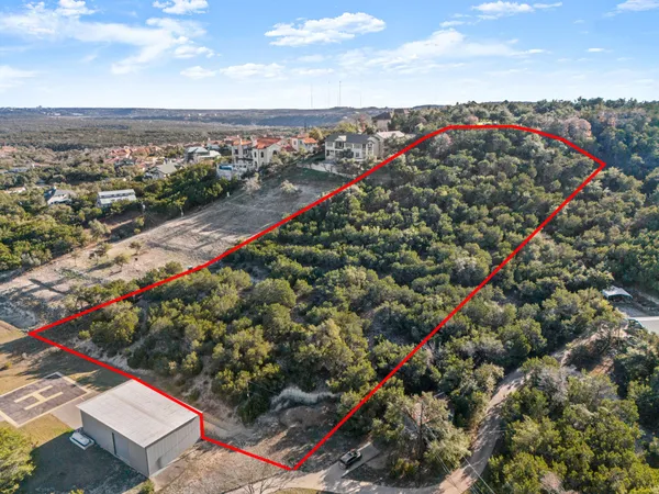 an aerial view of residential house with parking space