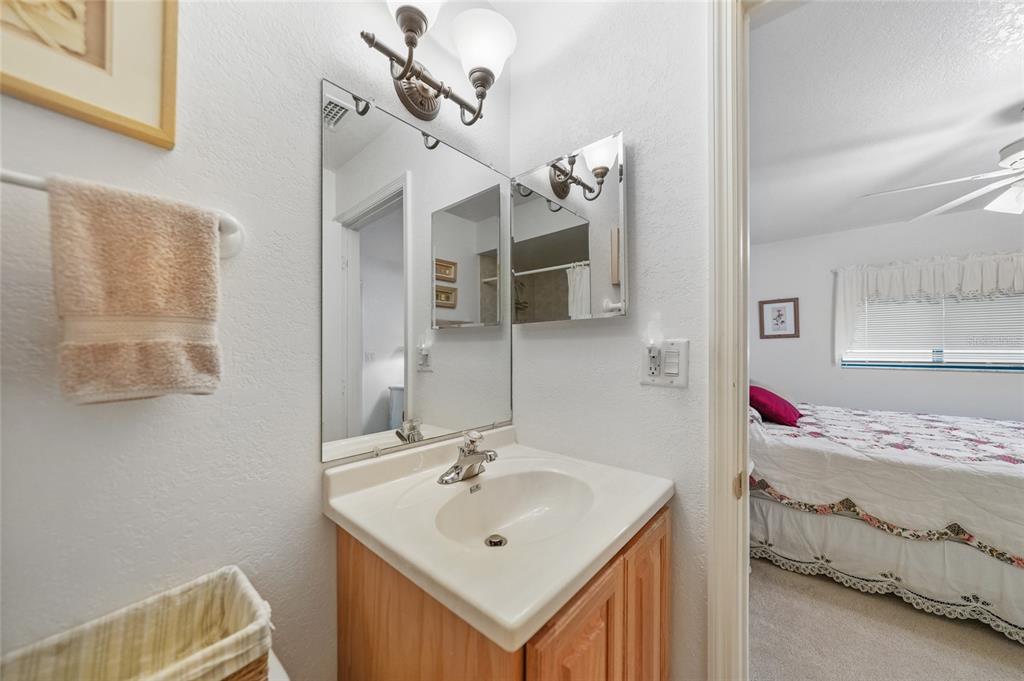 25225 Rampart Boulevard, Unit 1607 Punta Gorda, FL 33983 - Photo 20 of 48 a bathroom with a sink and a mirror