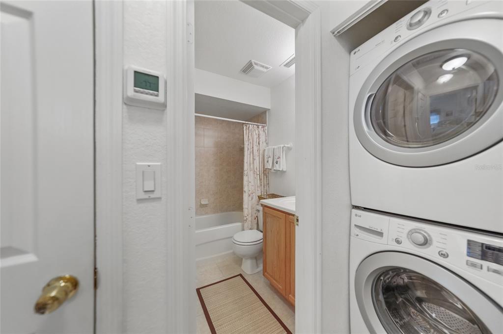 25225 Rampart Boulevard, Unit 1607 Punta Gorda, FL 33983 - Photo 25 of 48 a view of a bathroom with washing machine and racks