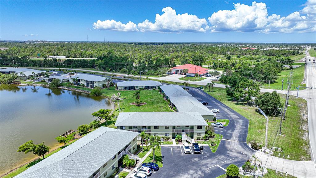 25225 Rampart Boulevard, Unit 1607 Punta Gorda, FL 33983 - Photo 31 of 48 an aerial view of a house with a swimming pool outdoor seating and yard