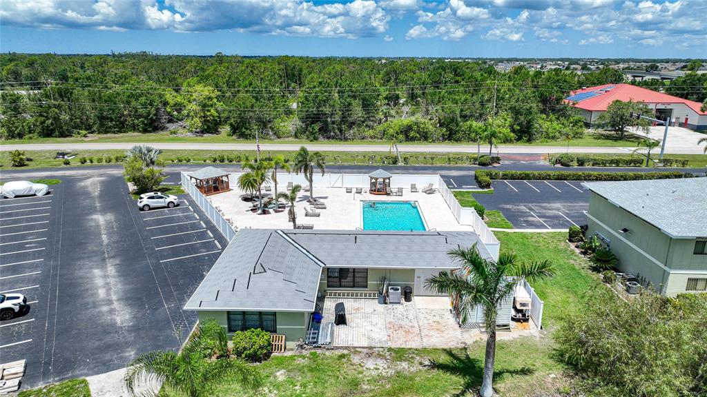 25225 Rampart Boulevard, Unit 1607 Punta Gorda, FL 33983 - Photo 33 of 48 an aerial view of house with a yard and a large pool