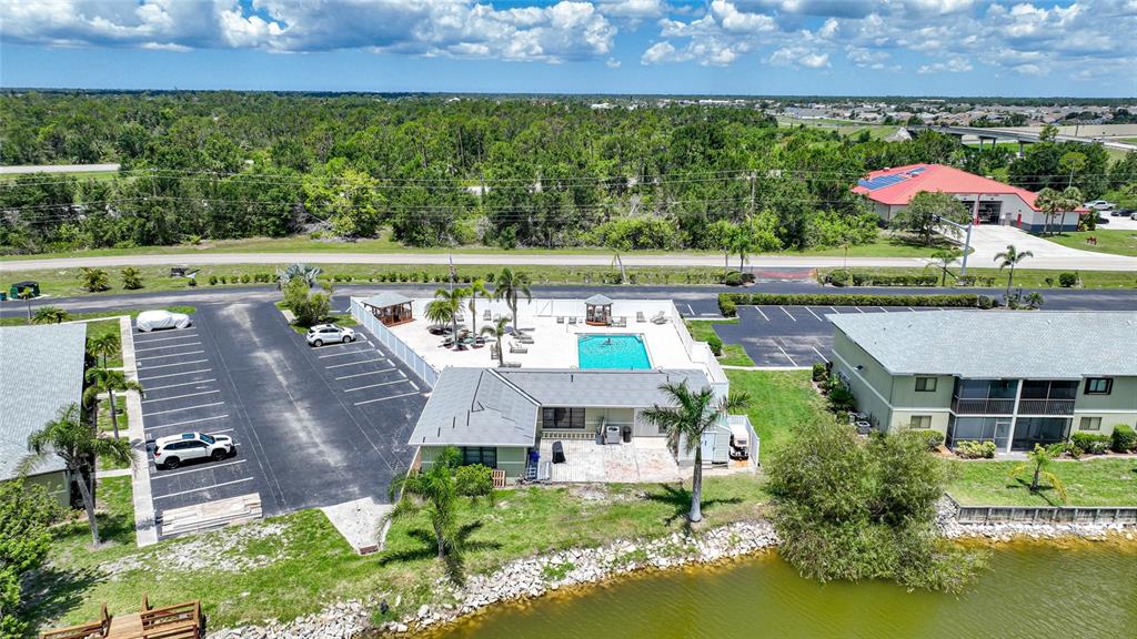 25225 Rampart Boulevard, Unit 1607 Punta Gorda, FL 33983 - Photo 34 of 48 an aerial view of house with yard swimming pool and outdoor seating
