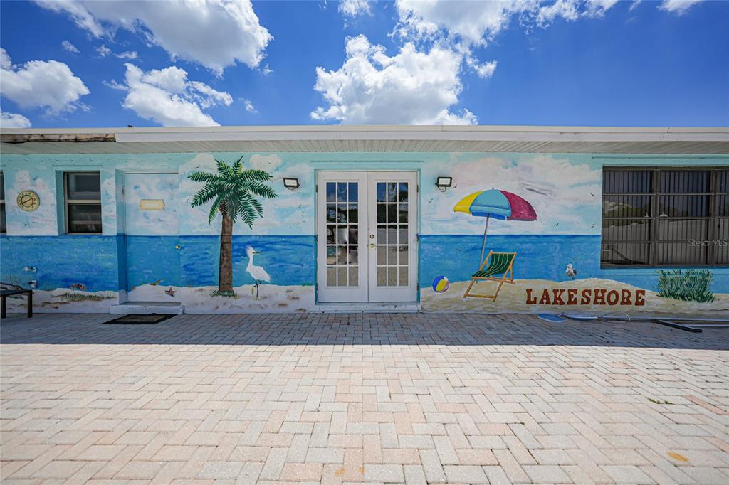 25225 Rampart Boulevard, Unit 1607 Punta Gorda, FL 33983 - Photo 38 of 48 a front view of a building with retail shops