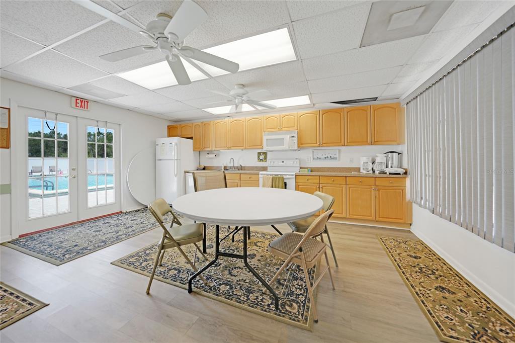 25225 Rampart Boulevard, Unit 1607 Punta Gorda, FL 33983 - Photo 40 of 48 a dining room with a table and chairs