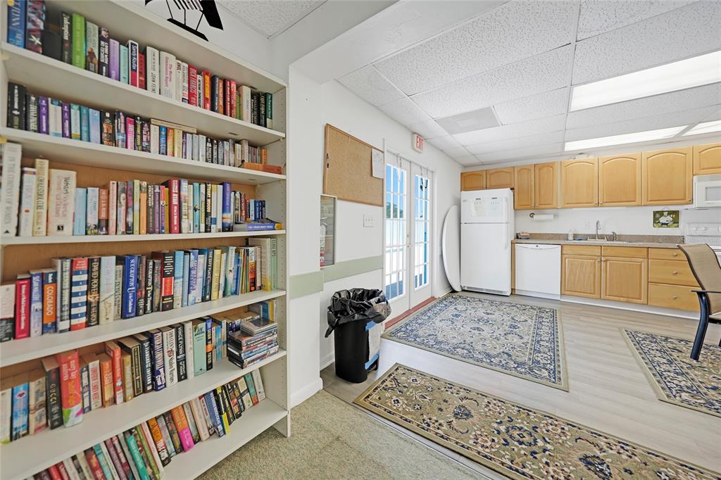 25225 Rampart Boulevard, Unit 1607 Punta Gorda, FL 33983 - Photo 42 of 48 a view of a living room with furniture and book shelf