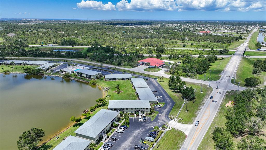 25225 Rampart Boulevard, Unit 1607 Punta Gorda, FL 33983 - Photo 44 of 48 an aerial view of a house with a lake view