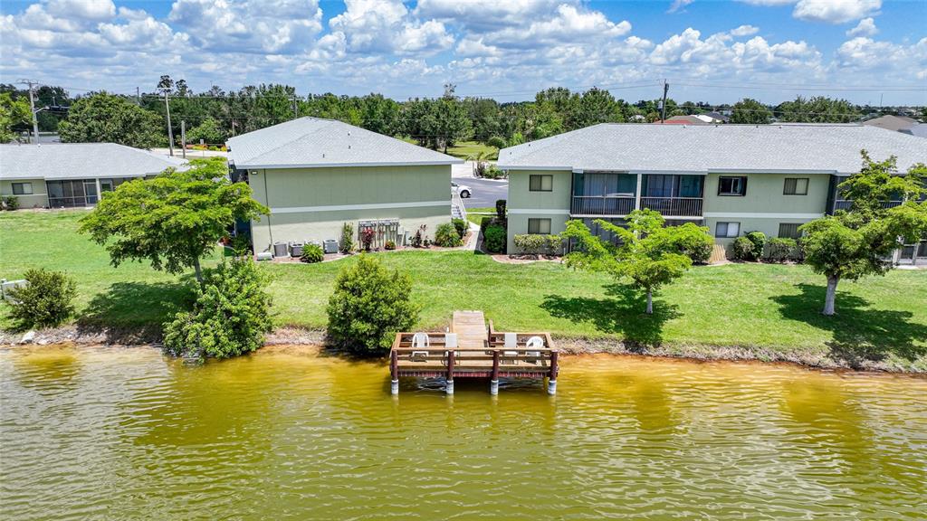 25225 Rampart Boulevard, Unit 1607 Punta Gorda, FL 33983 - Photo 47 of 48 a aerial view of a house with swimming pool outdoor seating and yard