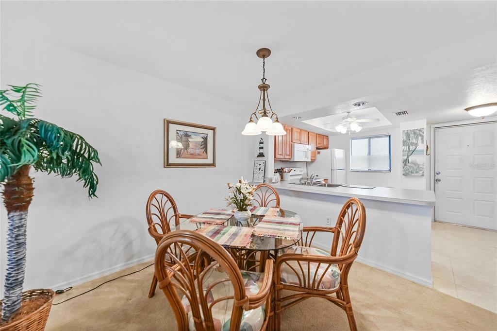 25225 Rampart Boulevard, Unit 1607 Punta Gorda, FL 33983 - Photo 9 of 48 a dining room with furniture and window