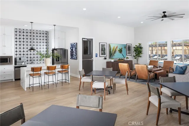 a living room with lots of furniture and a flat screen tv