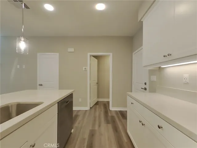 a spacious bathroom with a sink and a large mirror