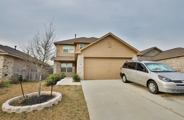 a car parked in front of a house