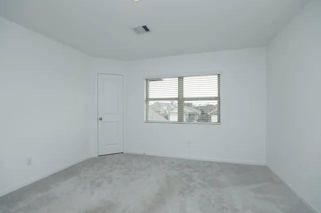 a view of an empty room and closet
