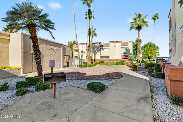 a swimming pool with outdoor seating and yard