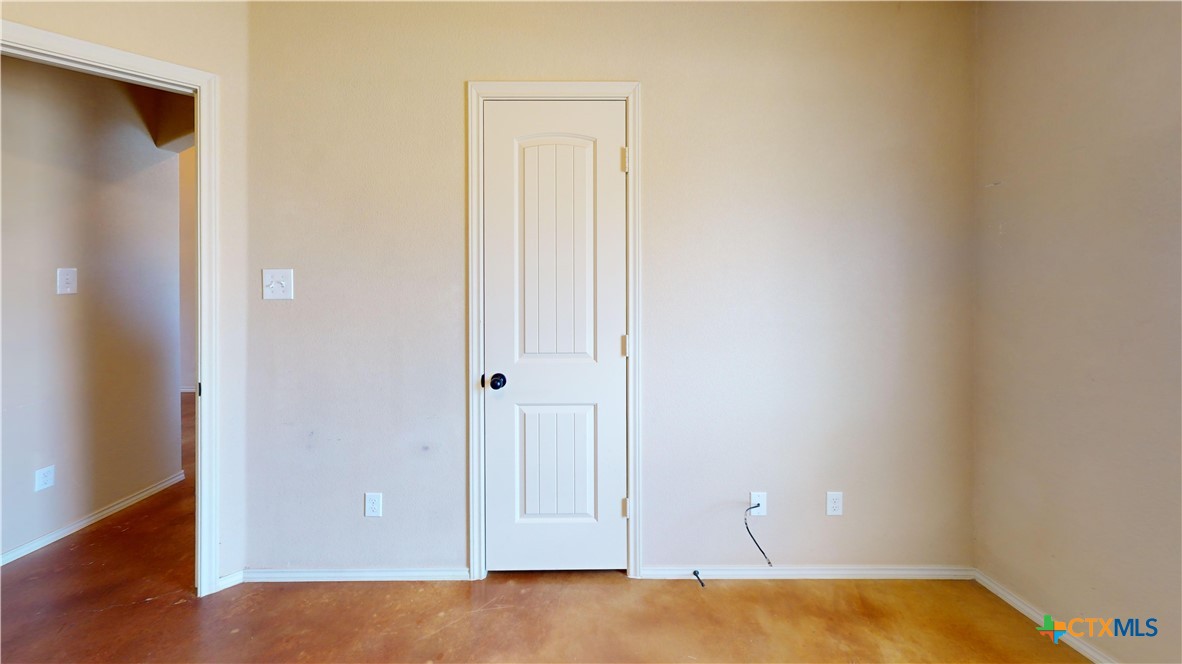 3401 Plateau Street Copperas Cove, TX 76522 - Photo 16 of 32 a view of an empty room with wooden floor and closet