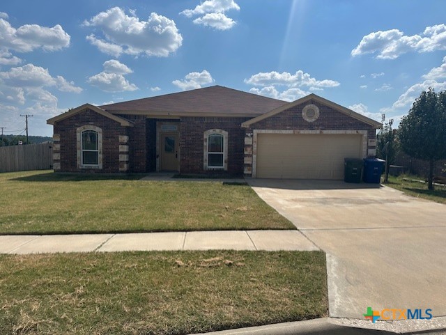 3401 Plateau Street Copperas Cove, TX 76522 - Photo 29 of 32 a front view of a house with a yard and a garage