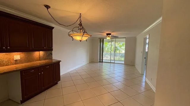 a view of a kitchen with a sink and cabinets