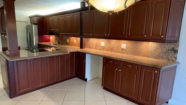 a kitchen with a sink and cabinets