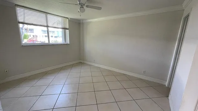 a view of an empty room with a window