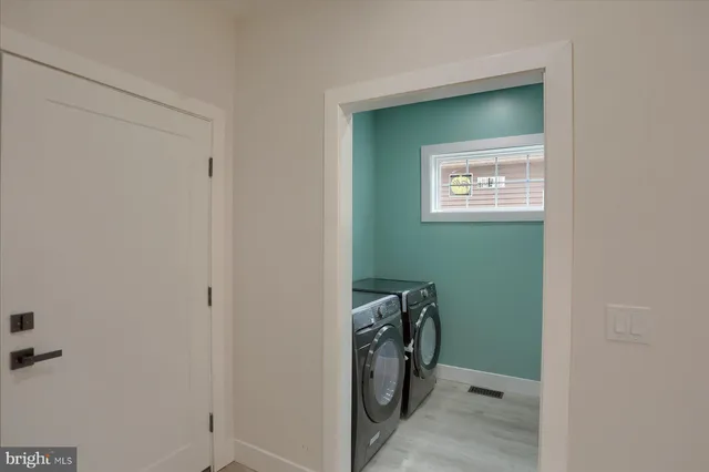 a white bath tub sitting next to a small white tub