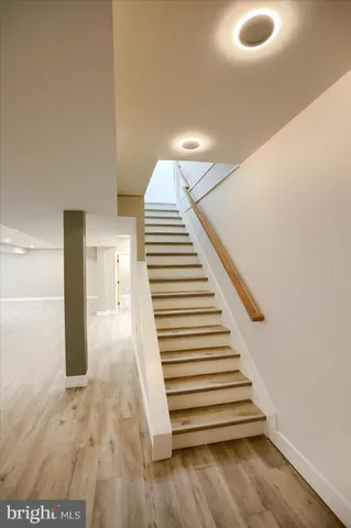 a bathroom with a sink a mirror and a shower