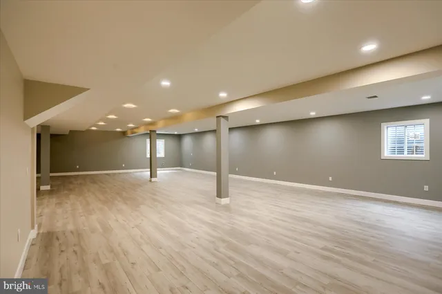 a view of a room with wooden floor