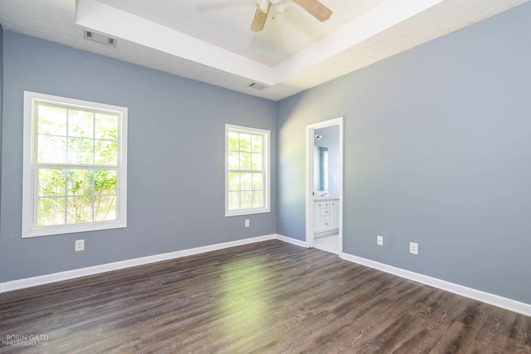 101 Hickory Road Jackson, GA 30233 - Photo 12 of 32 a view of an empty room with wooden floor and a window