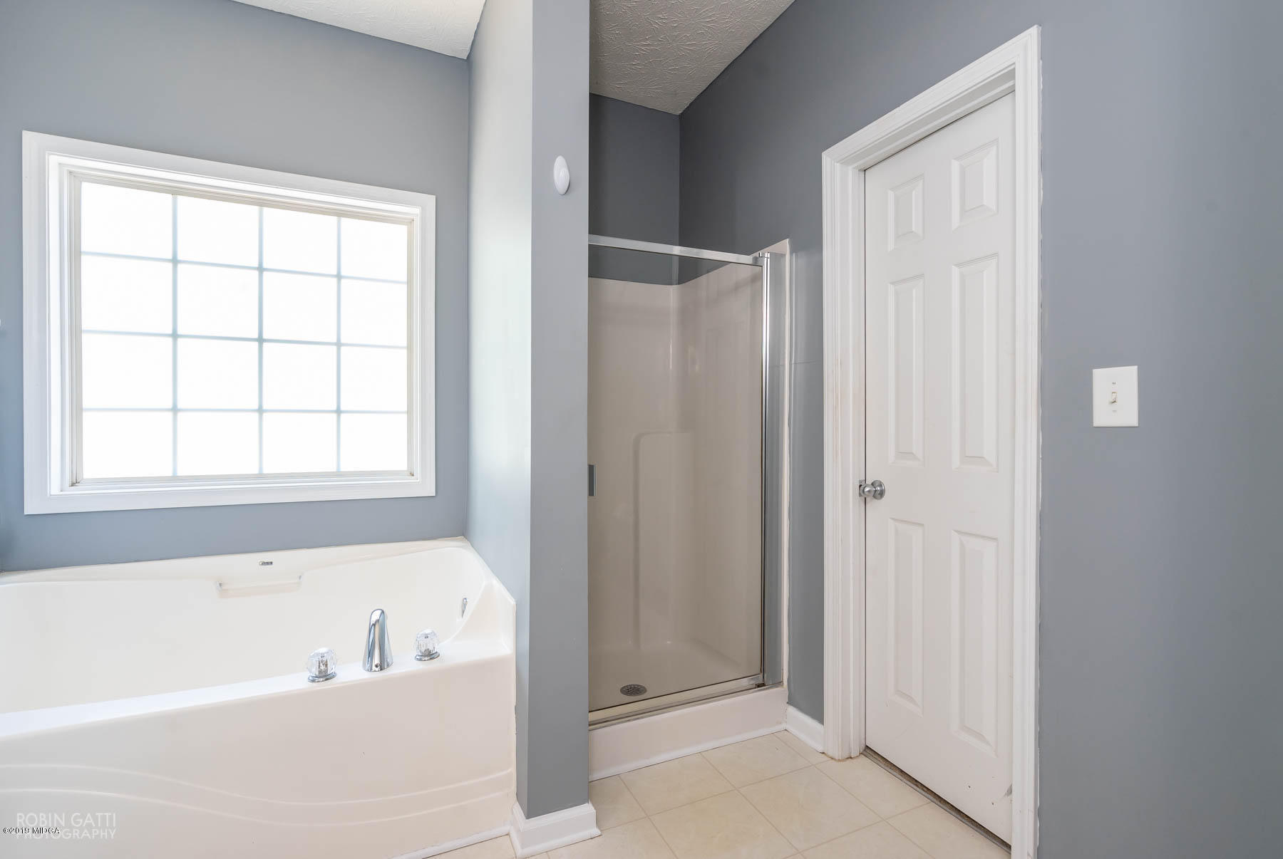 101 Hickory Road Jackson, GA 30233 - Photo 15 of 32 a bathroom with a bathtub and a shower