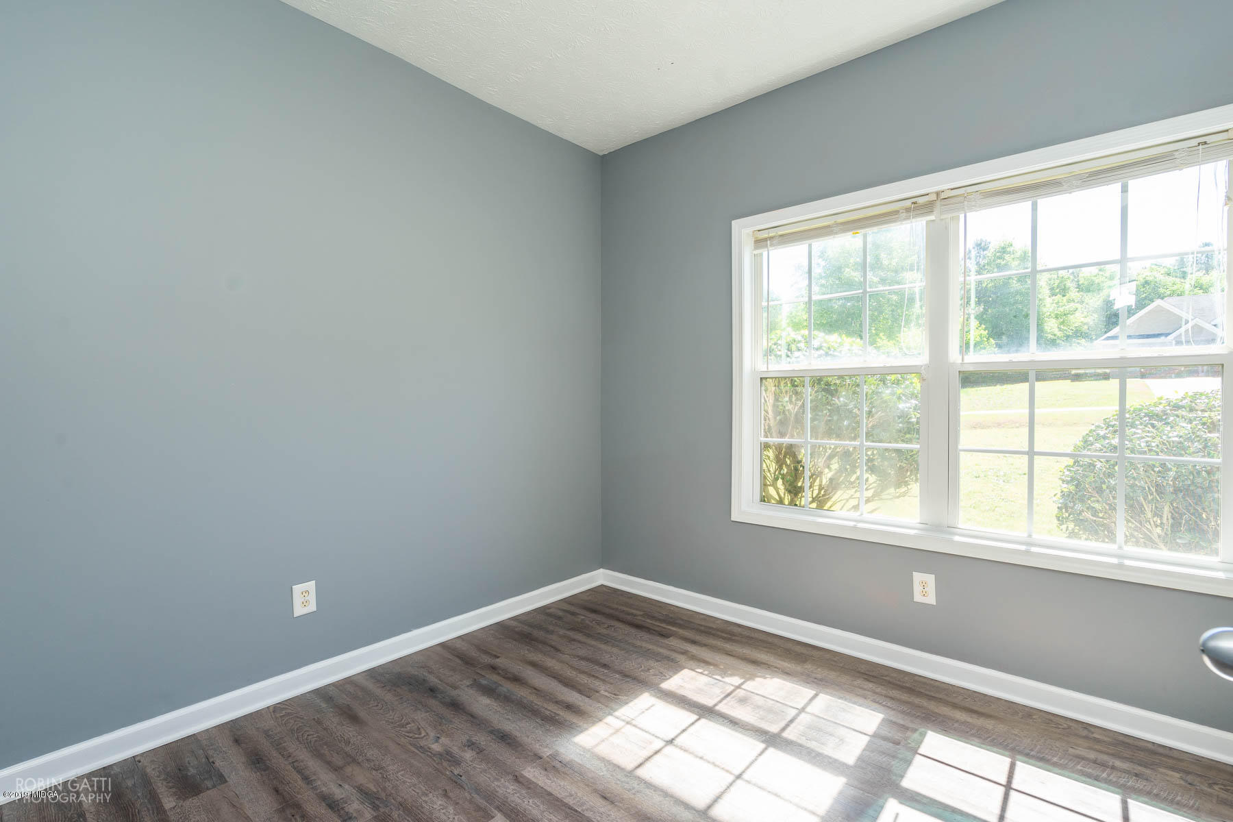 101 Hickory Road Jackson, GA 30233 - Photo 18 of 32 a view of empty room with wooden floor