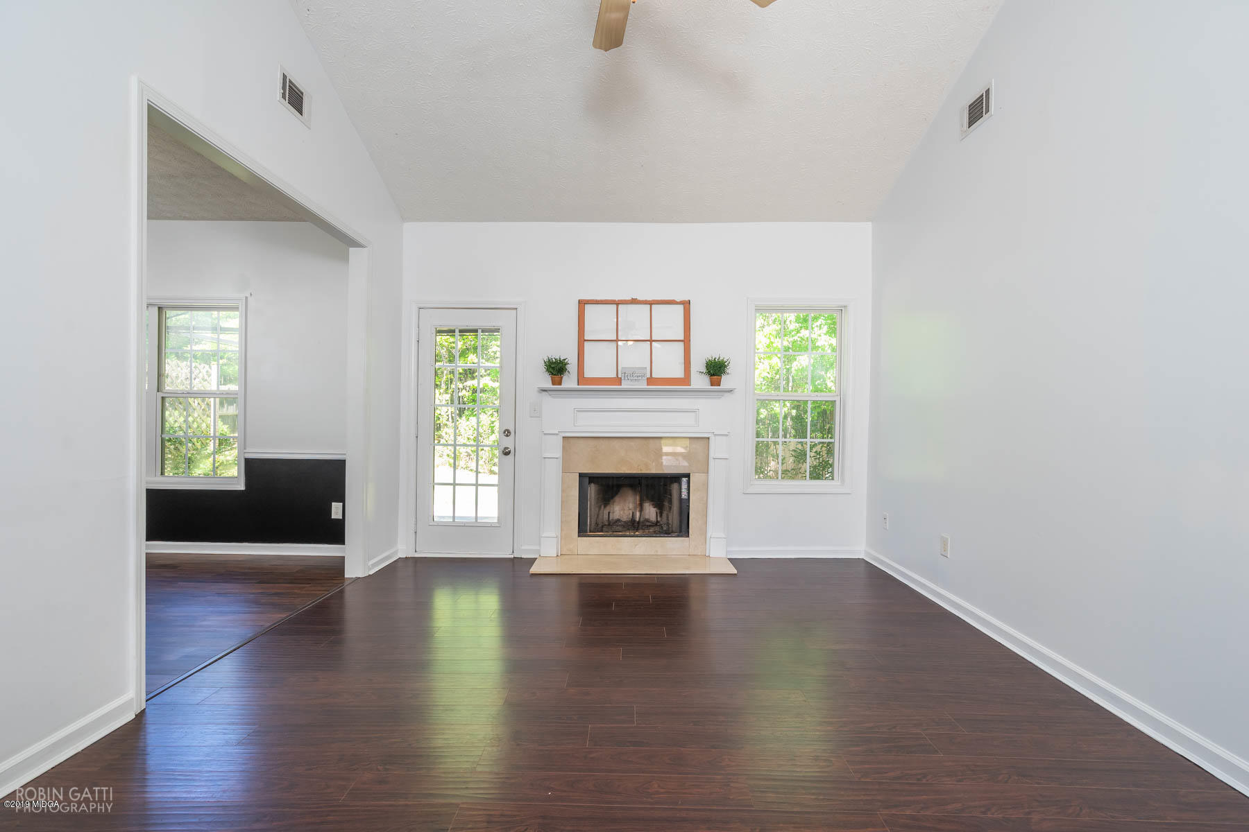 101 Hickory Road Jackson, GA 30233 - Photo 3 of 32 a view of a livingroom with a fireplace a fireplace and wooden floor